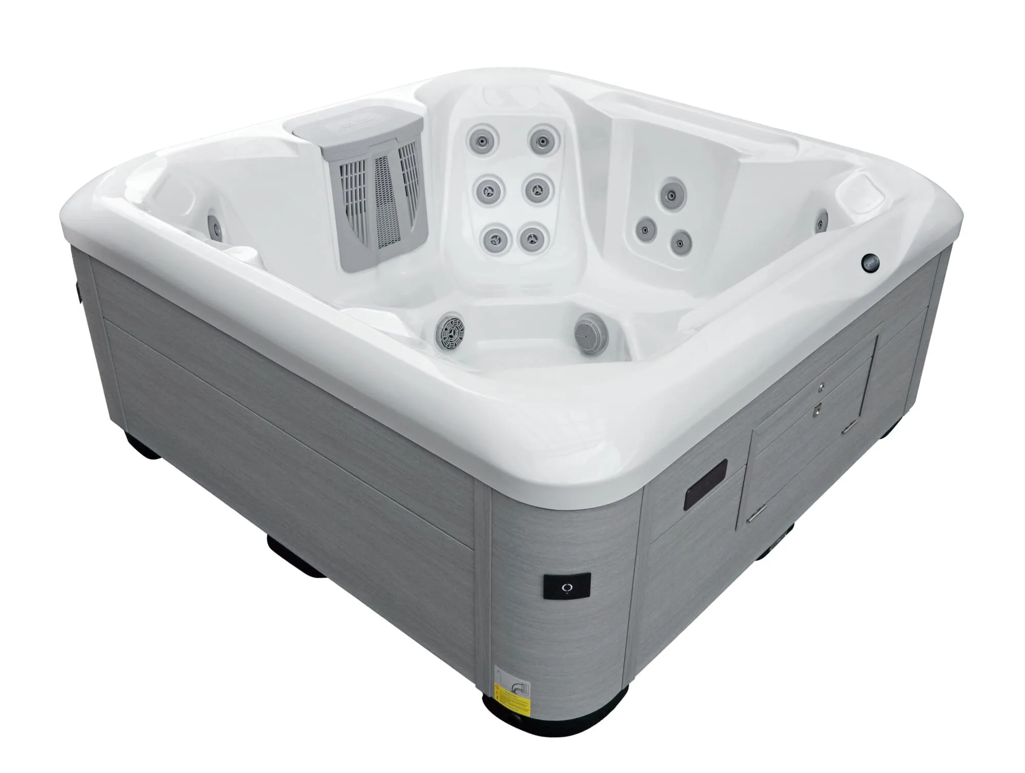 Angled interior view of the Vacation Cove Hot Tub, highlighting the targeted massage jets, filtration system housing, and spacious white acrylic seating.