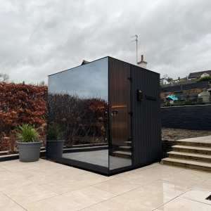 Eira Signature 240 outdoor sauna with mirrored glass finish, installed by Roberts Leisure Isle of Man.