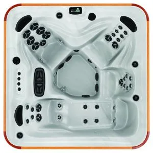 Overhead view of the Arctic Spas Cub hot tub shell in white, showing a versatile 4-5 person seating arrangement with a full-length lounger, available for Isle of Man customers.