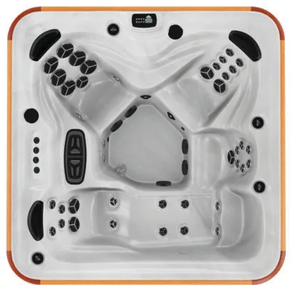 Overhead view of the Arctic Spas Cub hot tub shell in white, showing a versatile 4-5 person seating arrangement with a full-length lounger, available for Isle of Man customers.