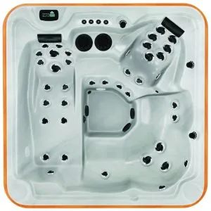 Overhead view of the Arctic Spas Lunar hot tub shell in white, a compact 3-person spa featuring a full-length lounger, available for installation on the Isle of Man.