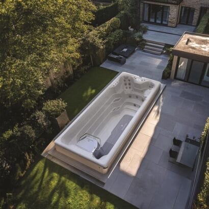 AquaSolus Flow Professional Swim Spa featuring an adjustable powerful swim current, ergonomic hydrotherapy seating, and Gecko K1000 touchscreen controls, Roberts Leisure Isle of Man.