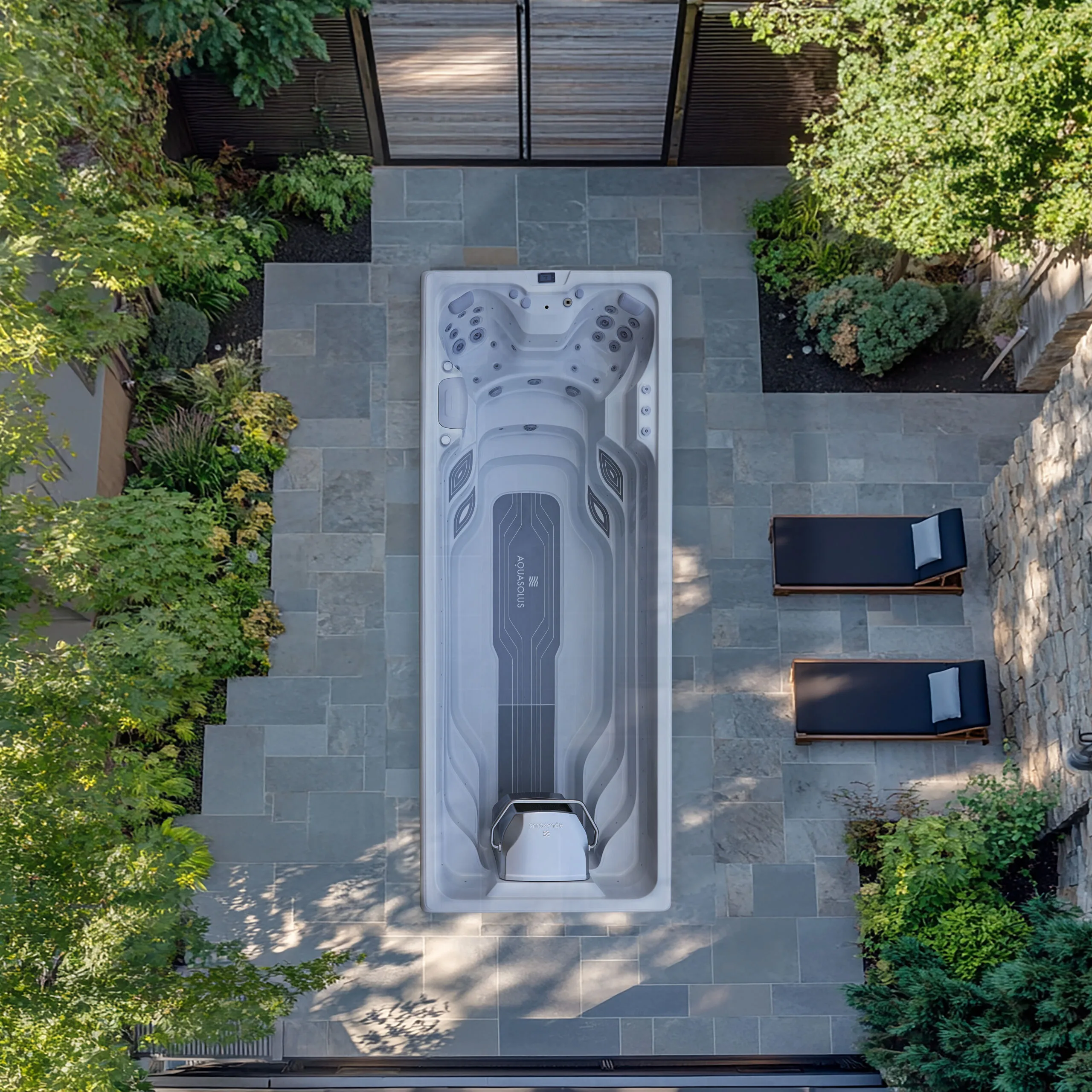 Overhead view of an AquaSolus Flow Pro swim spa installation in a luxury Isle of Man garden.