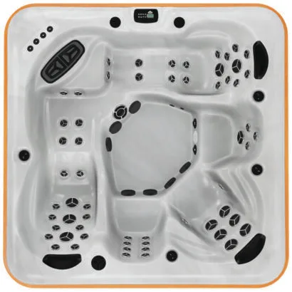 Overhead view of the Arctic Spas Klondiker hot tub in white, featuring a premium dual-lounger design and extensive jet clusters, available for installation across the Isle of Man.