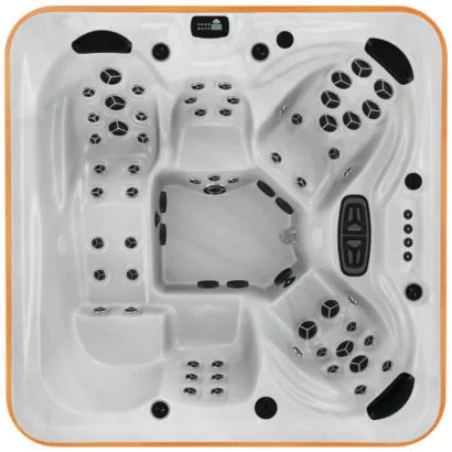 Overhead view of the Arctic Spas Kodiak hot tub shell in white, featuring a 5-6 person seating capacity with a full-body lounger and therapeutic jets, available for Isle of Man installation.