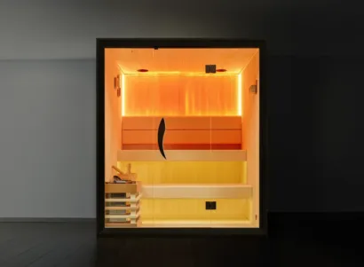 Luksus Aurora 4 flagship indoor traditional sauna with floating multi-level benches, panoramic architectural glass, and integrated sensory mood lighting, Roberts Leisure Isle of Man.