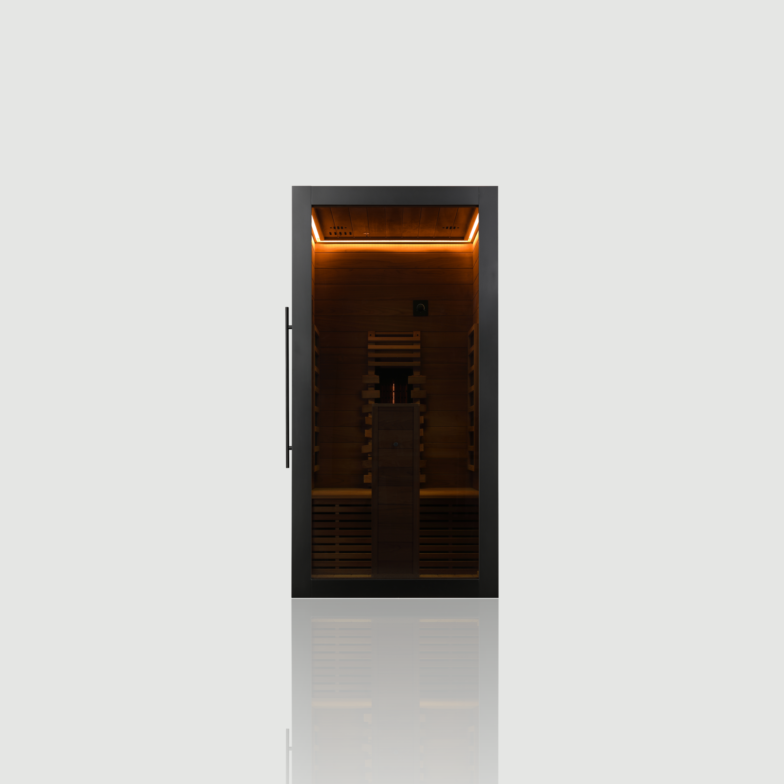 Straight-on front view of the 1-person Hekla IR 100 Infrared Sauna, featuring a modern black veneer exterior, 8mm grey safety glass door, and a brightly illuminated wood interior.
