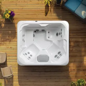 Overhead view of the Vacation Brook holiday let hot tub installed flush in a wooden deck, showing the comfortable seating and dedicated lounger layout.
