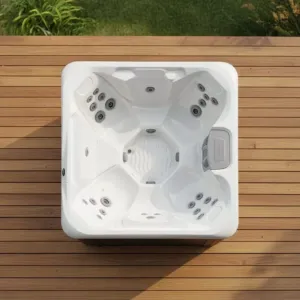 Overhead view of the square Vacation Cove Hot Tub showing its spacious open seating design and hydrotherapy jets, set flush in a wooden deck.