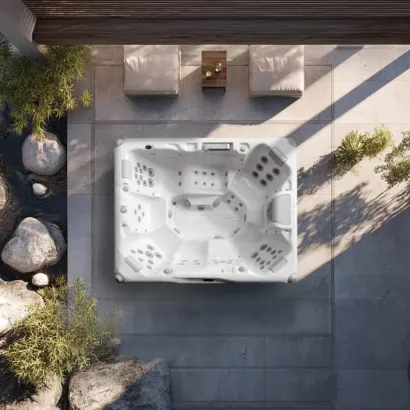 AquaSolus Zenith (Series 3) flagship 6-seater hot tub featuring a full-body lounger, 61 precision hydrotherapy jets, and Gecko K1000 touchscreen controls, Roberts Leisure Isle of Man.