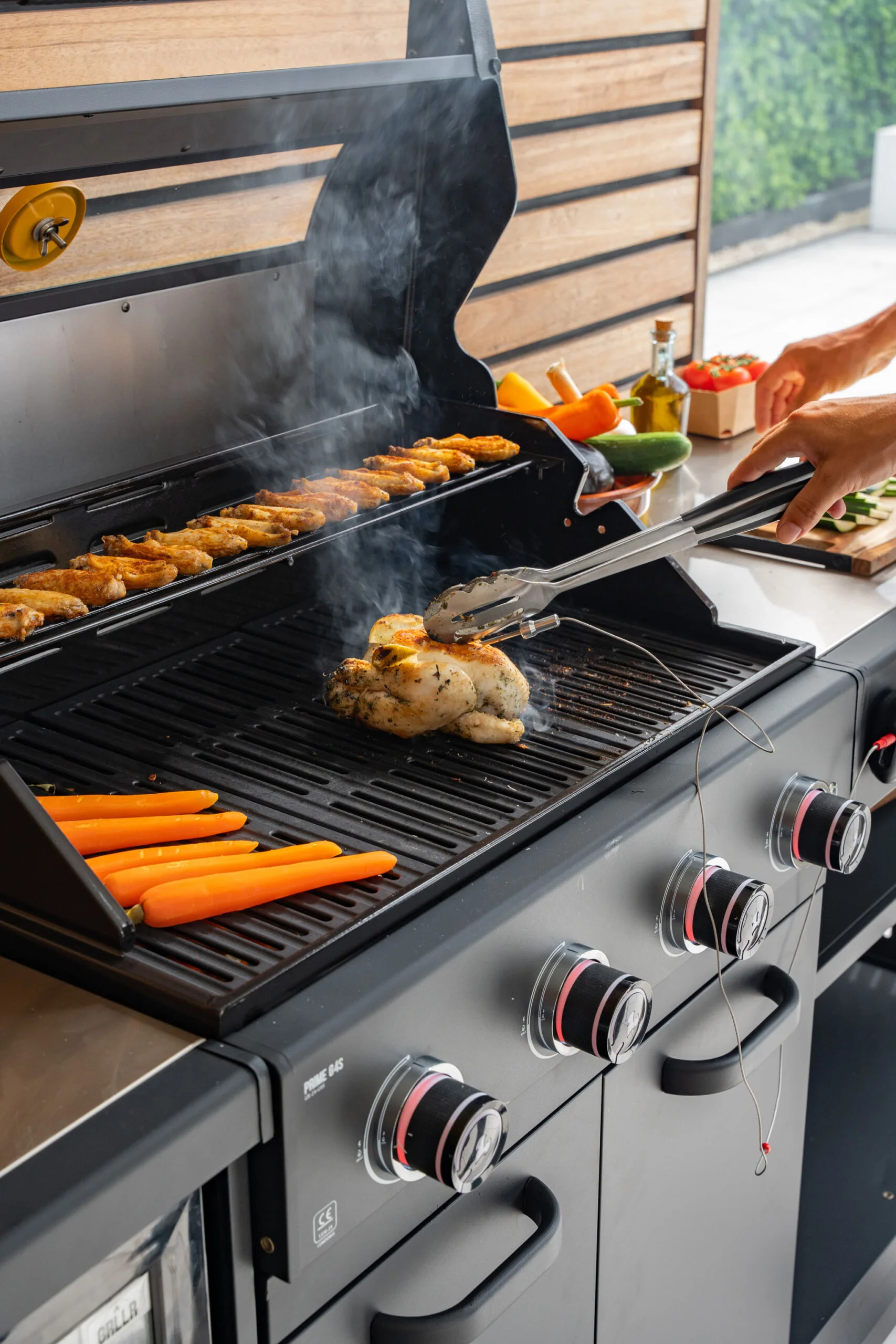 Grllr 4-burner professional gas grill featuring precision heat control, heavy-duty cast iron grates, and weather-resistant stainless steel construction, Roberts Leisure Isle of Man.
