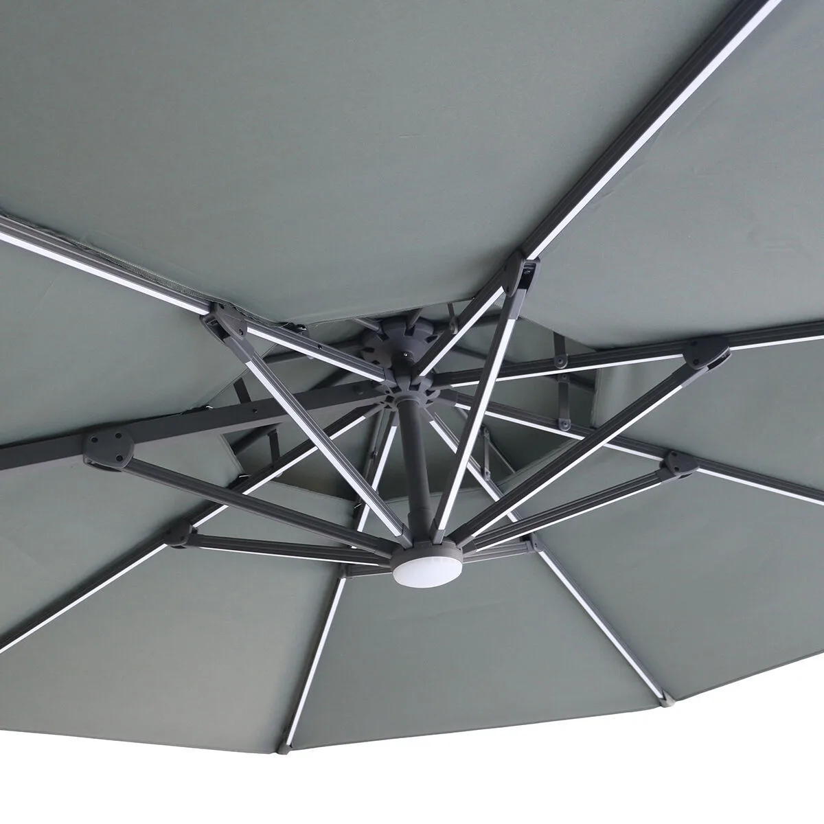 Close-up of the inner structure of the Oil Green Maze Apollo Solar LED 3m Round Rotating Cantilever Parasol, highlighting the LED light ribs and vented top, from Roberts Leisure in the Isle of Man.