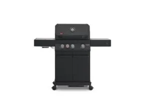 A direct front view of a matte black Primeliner G3 gas barbecue grill featuring a closed lid with an integrated temperature gauge, four control knobs, dual side shelves, and a two-door storage cabinet on wheels.