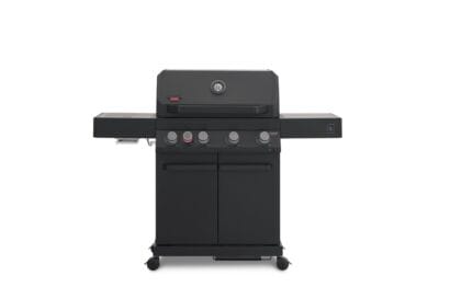A direct front view of a matte black Primeliner G4 gas barbecue grill featuring a closed lid with an integrated temperature gauge, five control knobs, dual side shelves, and a two-door storage cabinet on wheels.