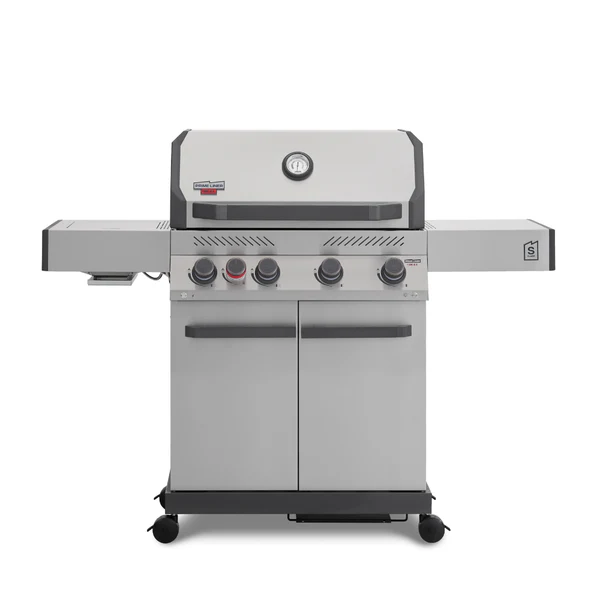 A direct front view of a stainless steel Primeliner S4 gas barbecue grill featuring a closed lid with an integrated temperature gauge, five control knobs, dual side shelves, and a two-door storage cabinet on wheels.