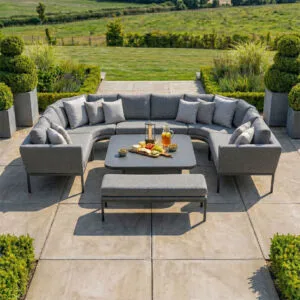 Top-down perspective of the Maze - Outdoor Fabric Pulse U Shape Corner Dining Set with Rising Table - Zinc Grey on a modern stone patio at Roberts Leisure, Isle of Man.
