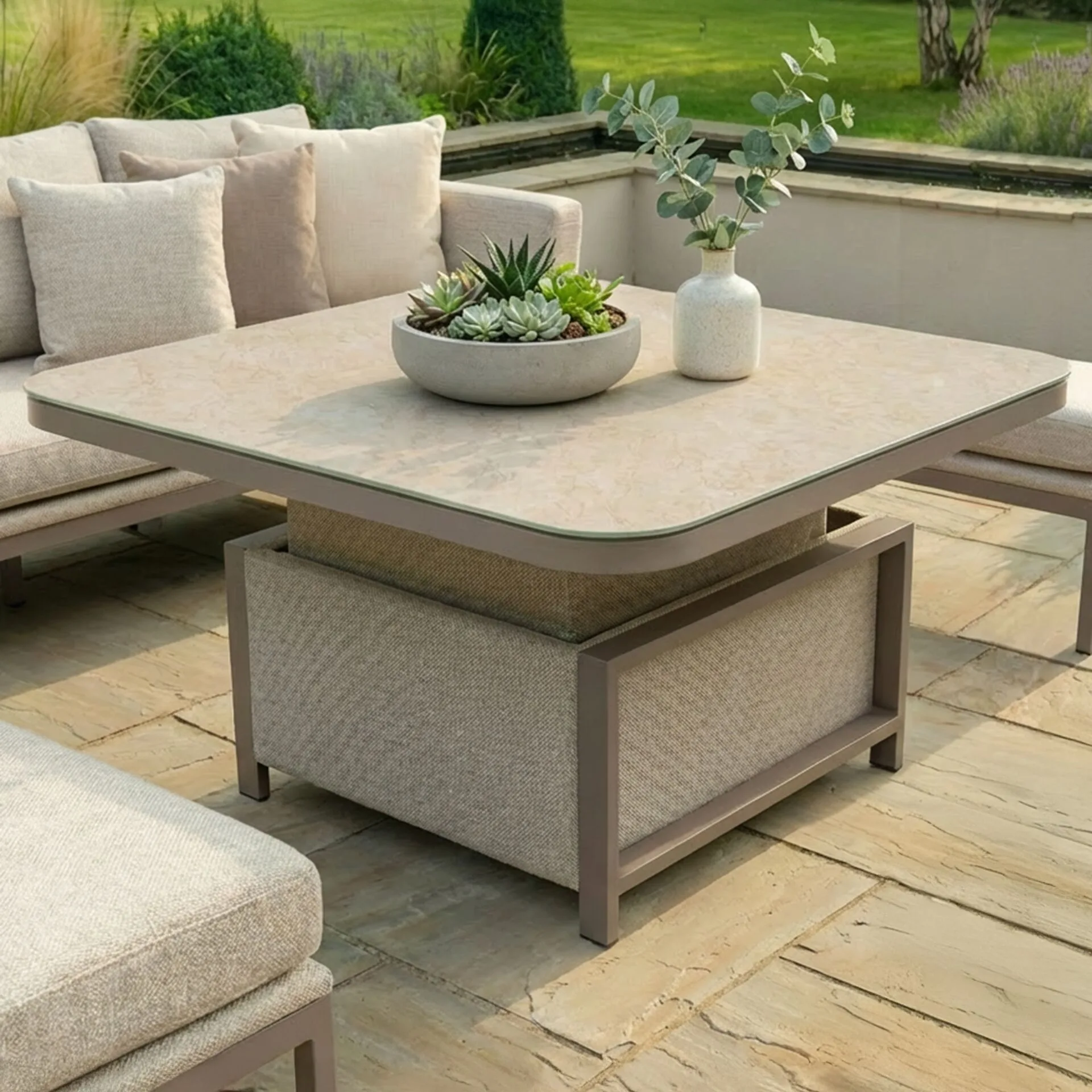 Close-up of the versatile adjustable rising table included with the Maze - Outdoor Fabric Pulse U Shape Corner Dining Set with Rising Table - Latte with cafe frame from Roberts Leisure, Isle of Man.