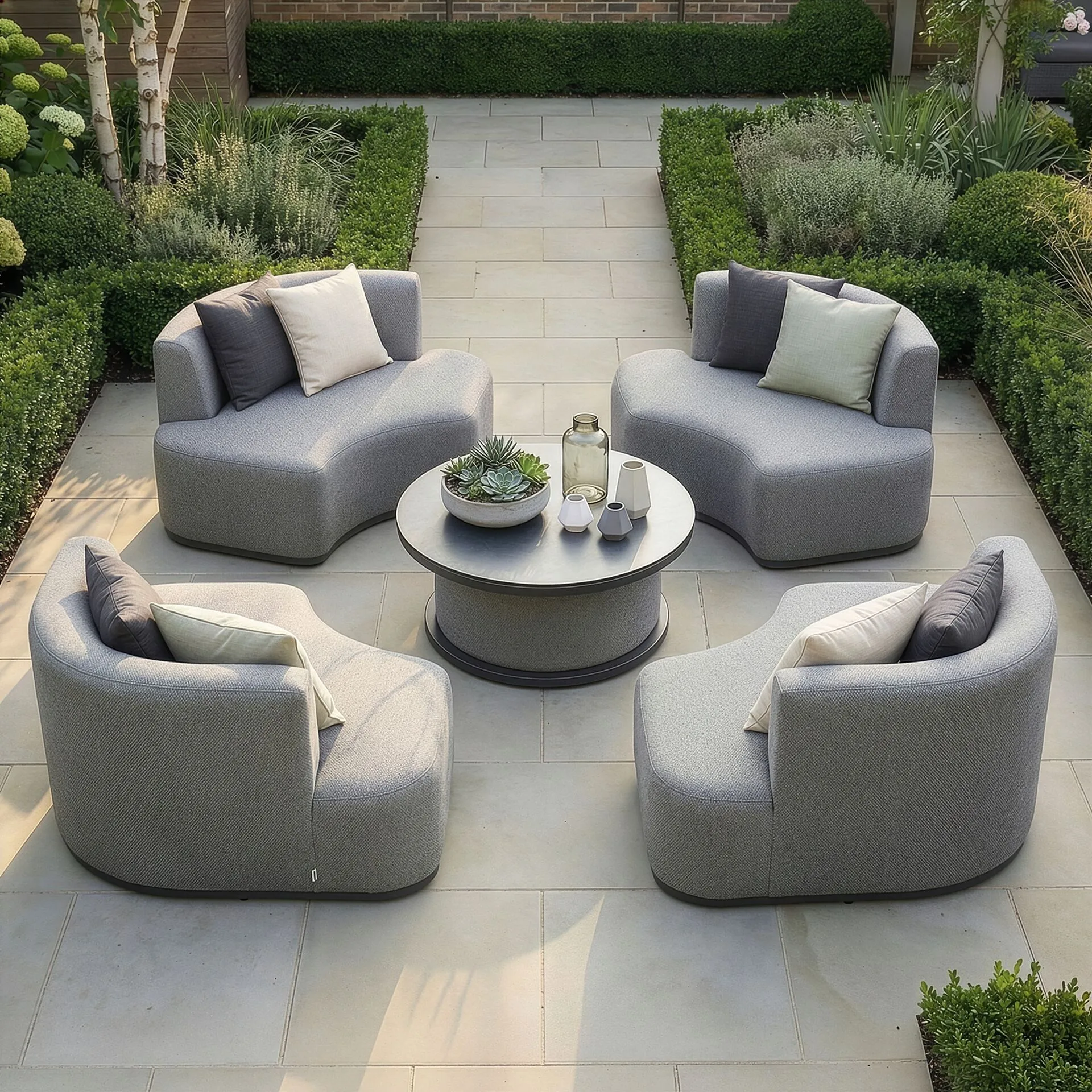 Aerial view of the Outdoor Fabric Snug Lifestyle Suite with Rising Table - Zinc Grey featuring four powder-coated aluminium chairs and a central ceramic glass table at Roberts Leisure, Isle of Man.