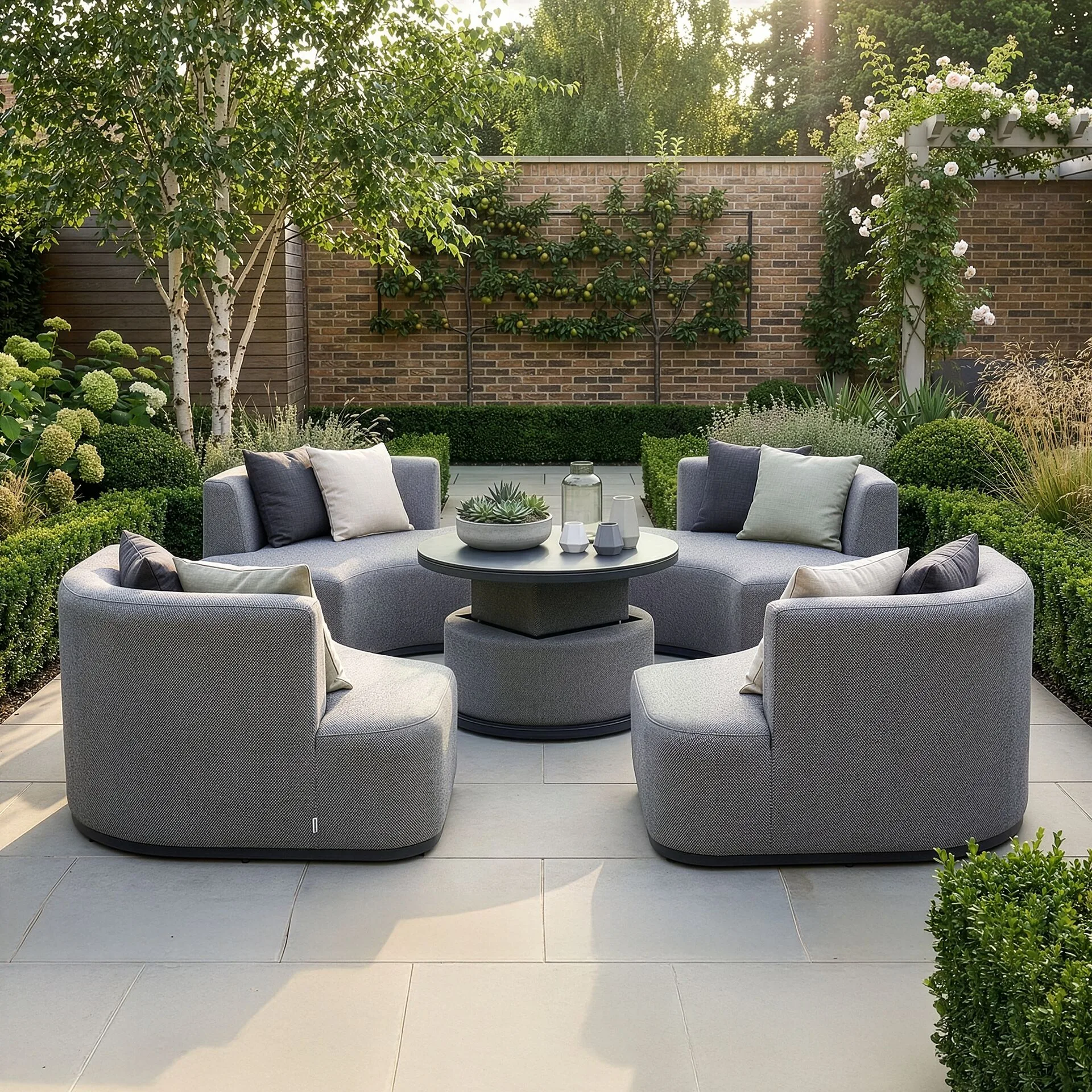 The Outdoor Fabric Snug Lifestyle Suite with Rising Table - Zinc Grey configured for casual dining with the rising table elevated, available at Roberts Leisure, Isle of Man.