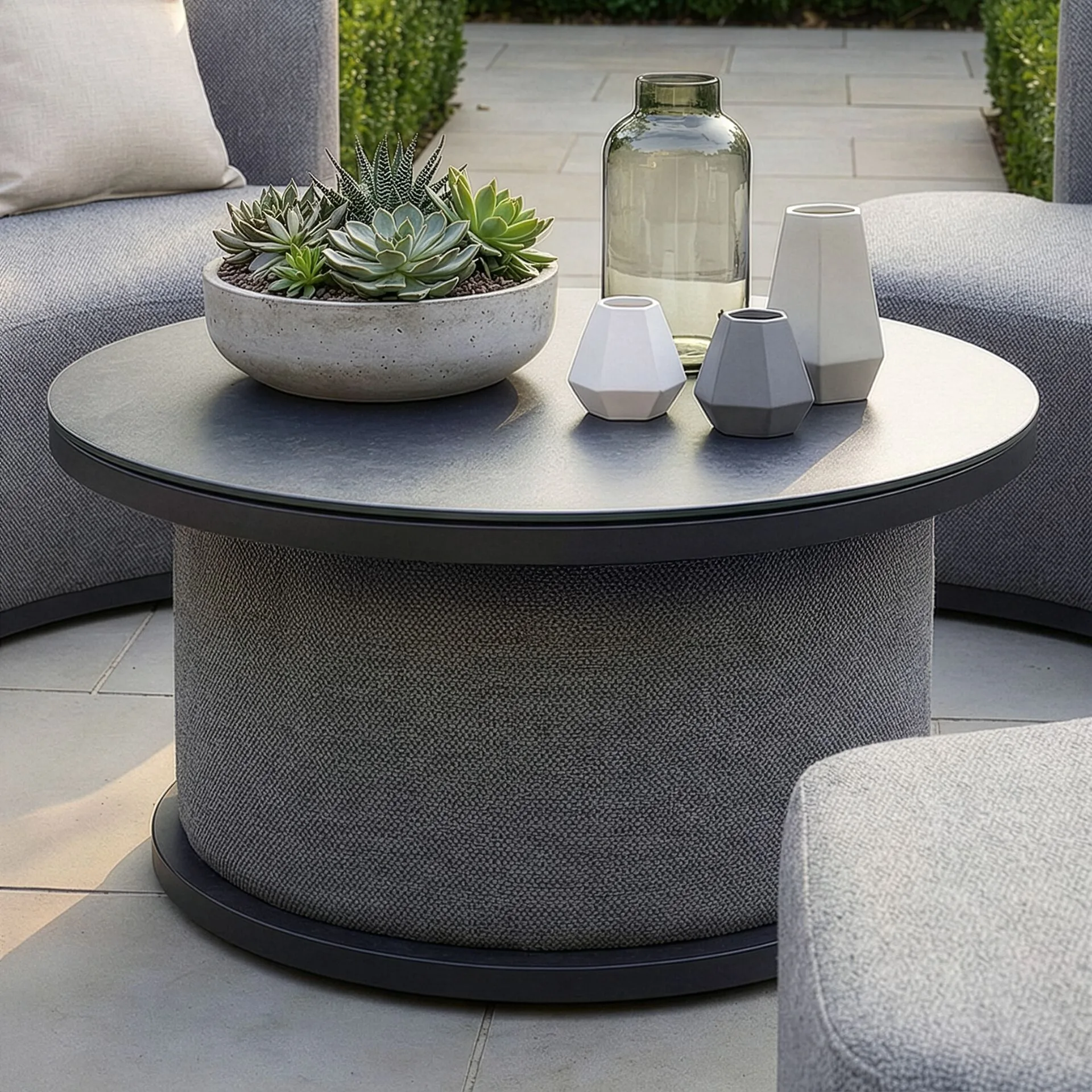 Close-up of the ceramic glass tabletop on the Outdoor Fabric Snug Lifestyle Suite with Rising Table - Zinc Grey, available at Roberts Leisure, Isle of Man.
