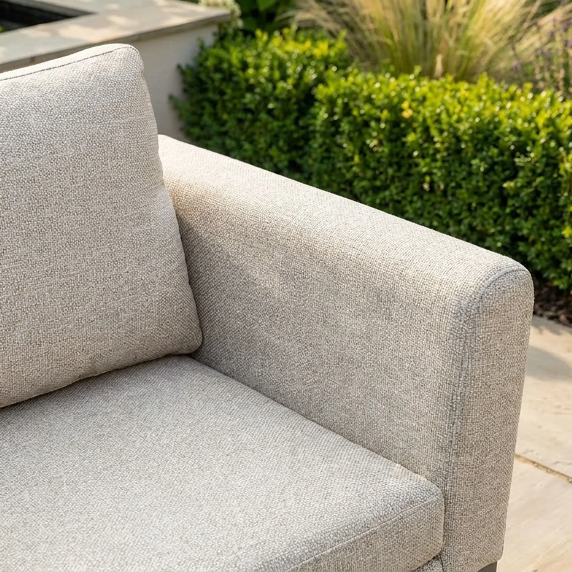 Close-up of the premium latte outdoor fabric on the Maze - Outdoor Fabric Pulse Deluxe Square Corner Dining Set with Rising Table - Latte with cafe frame, showcased at Roberts Leisure, Isle of Man.