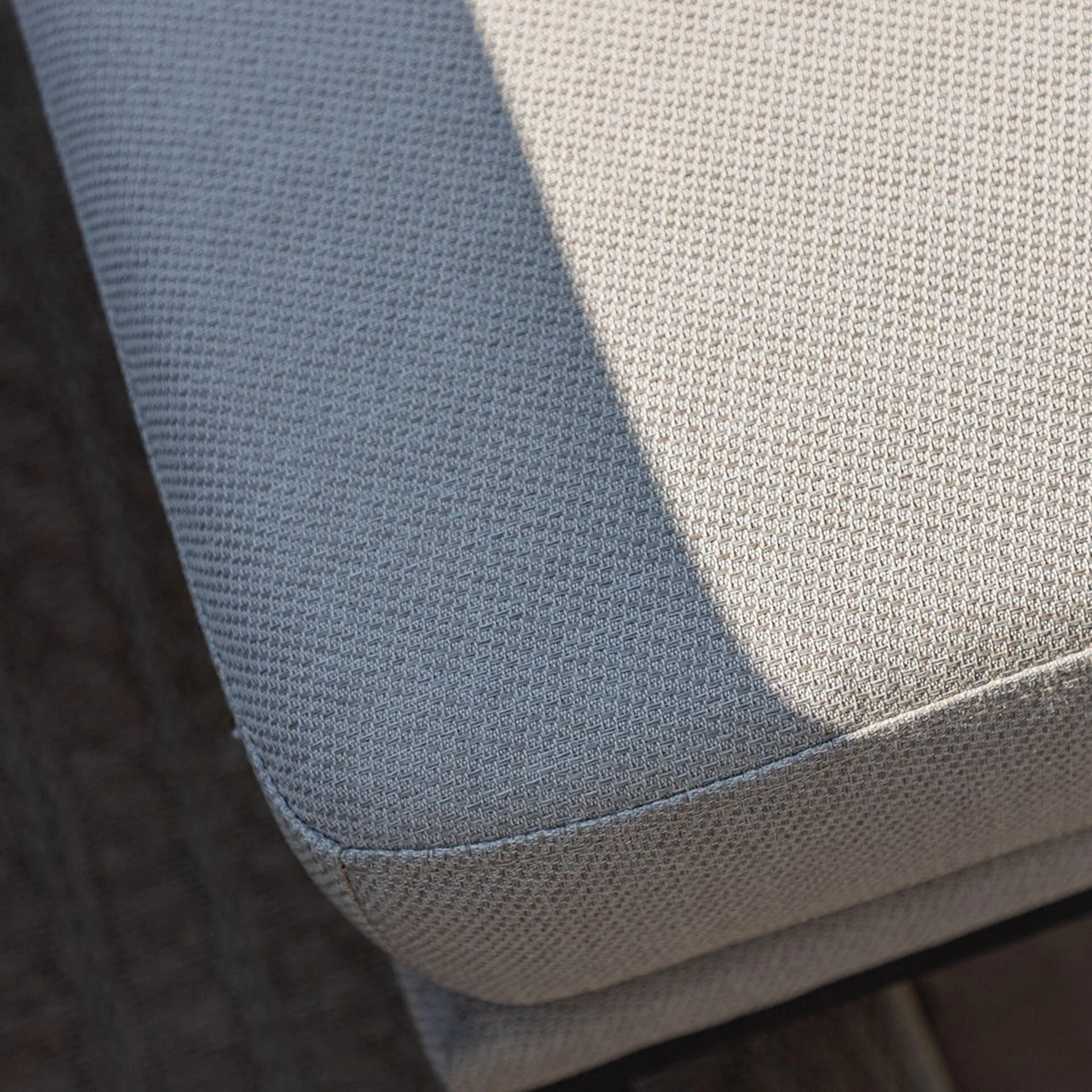 Detailed top-down view of the woven texture on the solution-dyed acrylic Oatmeal cushion from the Maze Pulse outdoor fabric set.