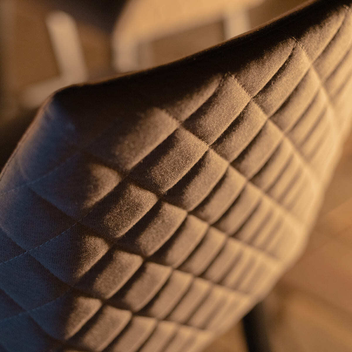 Close-up of the quilted solution-dyed acrylic fabric on a bar stool from the Maze - Outdoor Fabric Regal 8 Seat Rectangular Bar Set Latte with café frame, available at Roberts Leisure, Isle of Man.