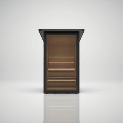 Straight front view of the Hekla Mini Cabin garden sauna, showcasing the full glass front and warm, illuminated wooden interior, available at Roberts Leisure in the Isle of Man.